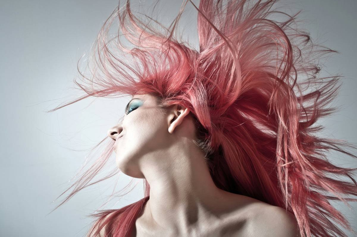 Professional applying hair care therapy treatment in salon setting